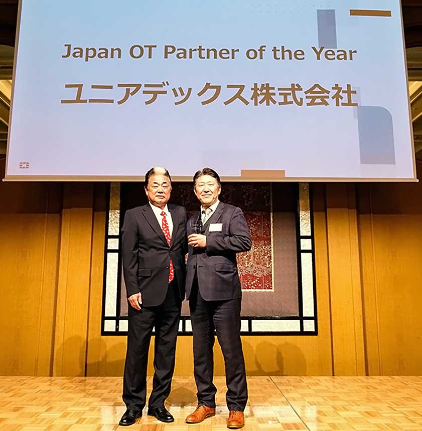 フォーティネットジャパン合同会社 社長執行役員　与沢 和紀 氏、ユニアデックス株式会社 業務執行役員　中村 智弘